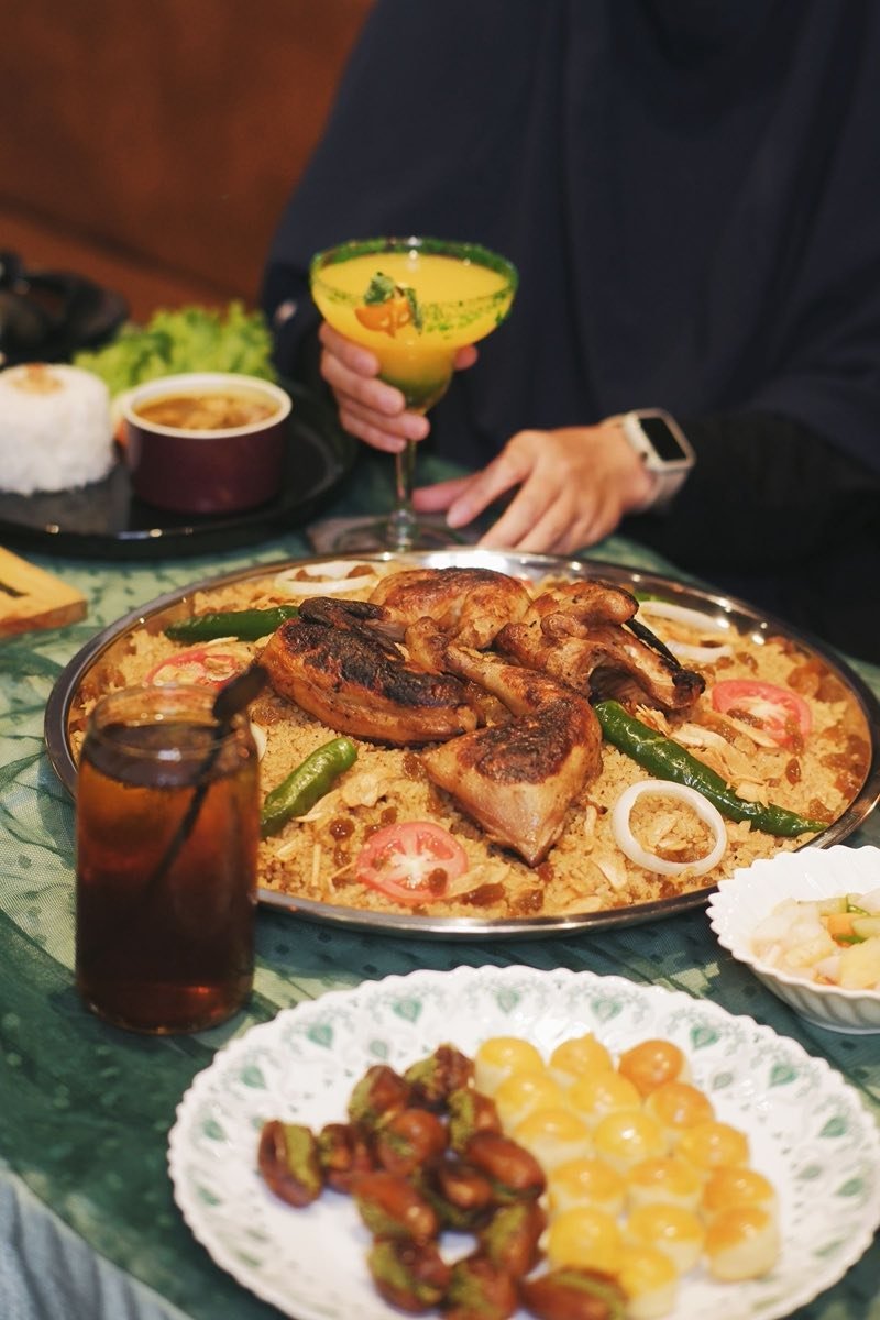 A traditional Indonesian halal meal spread with rice and grilled chicken