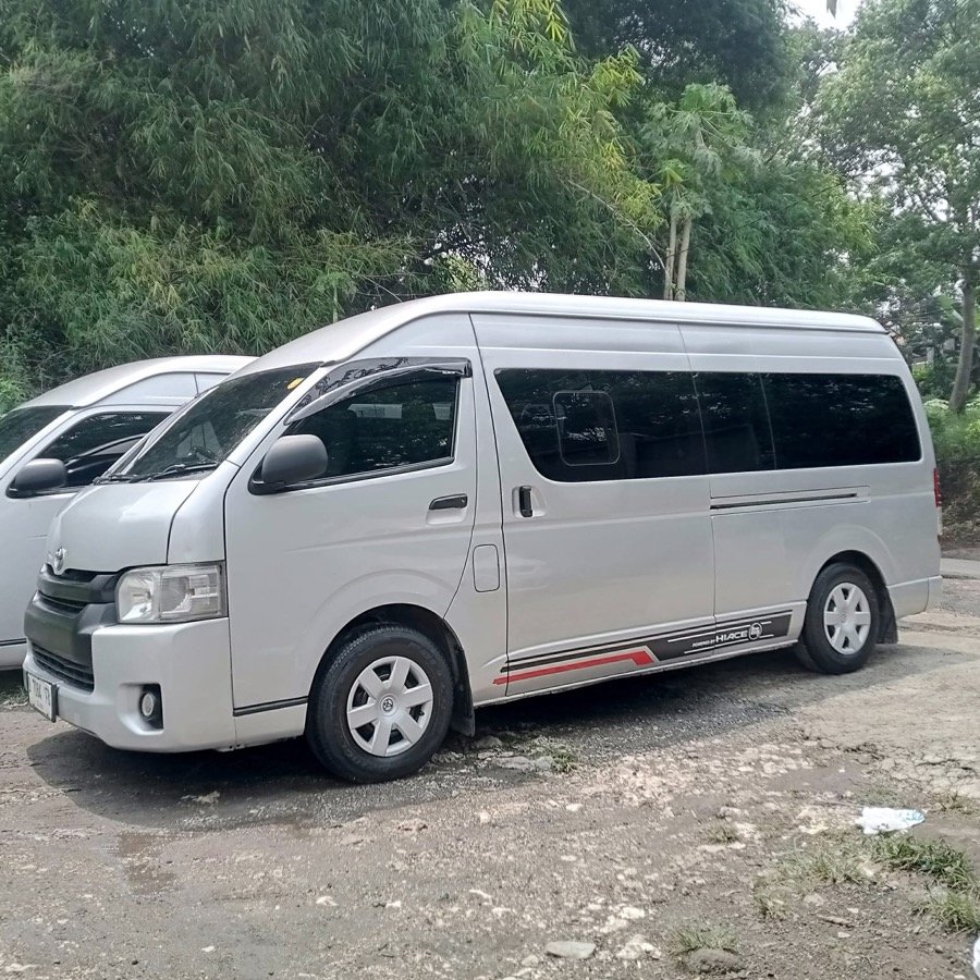 A premium Hiace-class van used for tours in Bandung